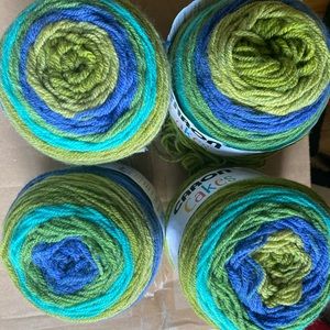 Four Caron cakes blueberry kiwi yarn